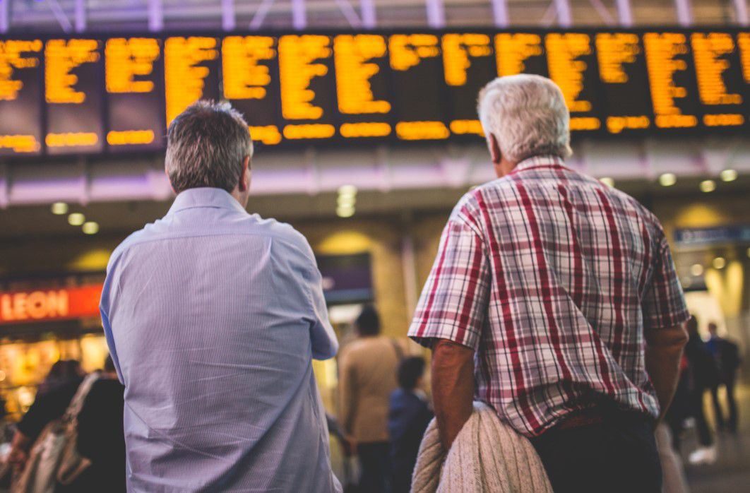 Checking Timetable at Train Station