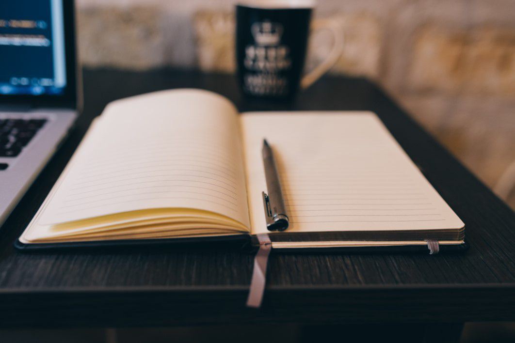 Notepad, MacBook and Coffee Mug