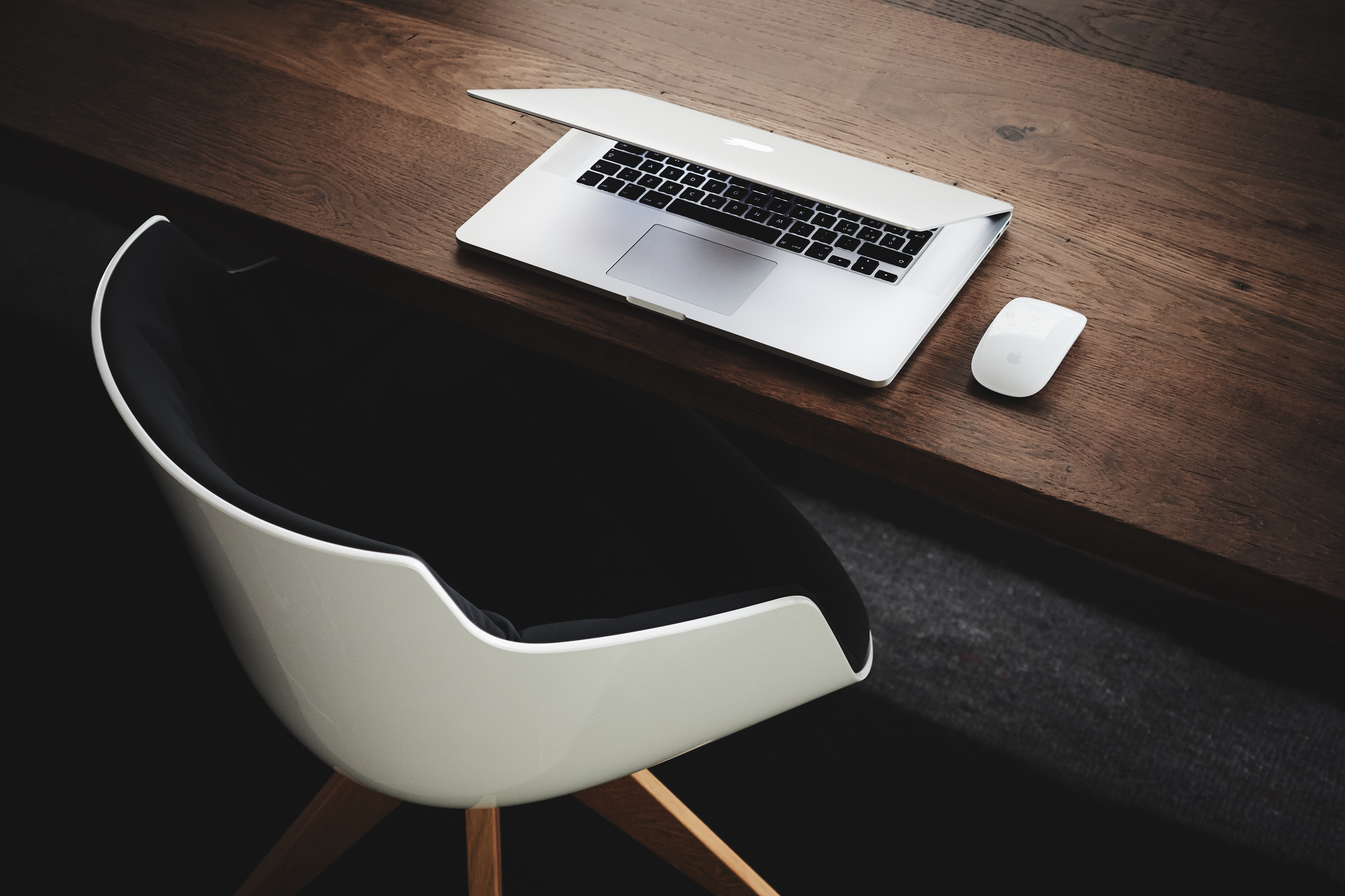 MacBook on Wooden Desk