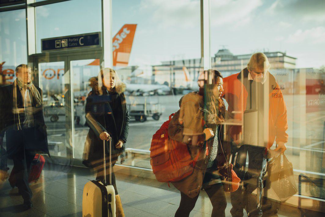 People Walking Through an Airport