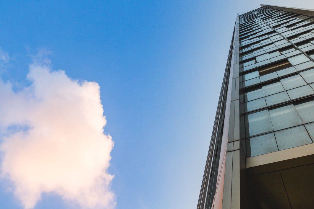 Glass Skyscraper Building and Clouds