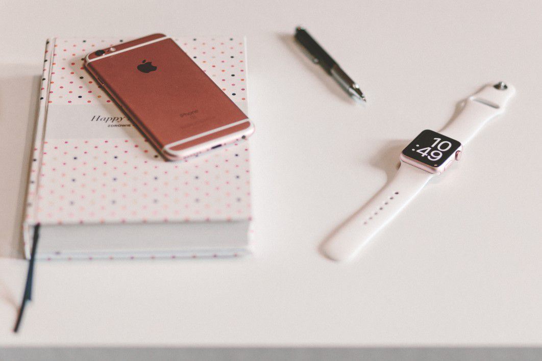 White Apple Watch and iPhone