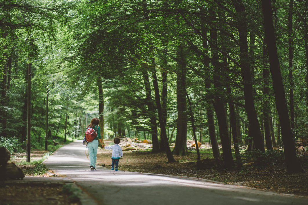 Woman and Child Walking in Park
