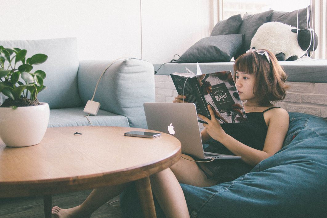 Woman on Beanbag Reading Book