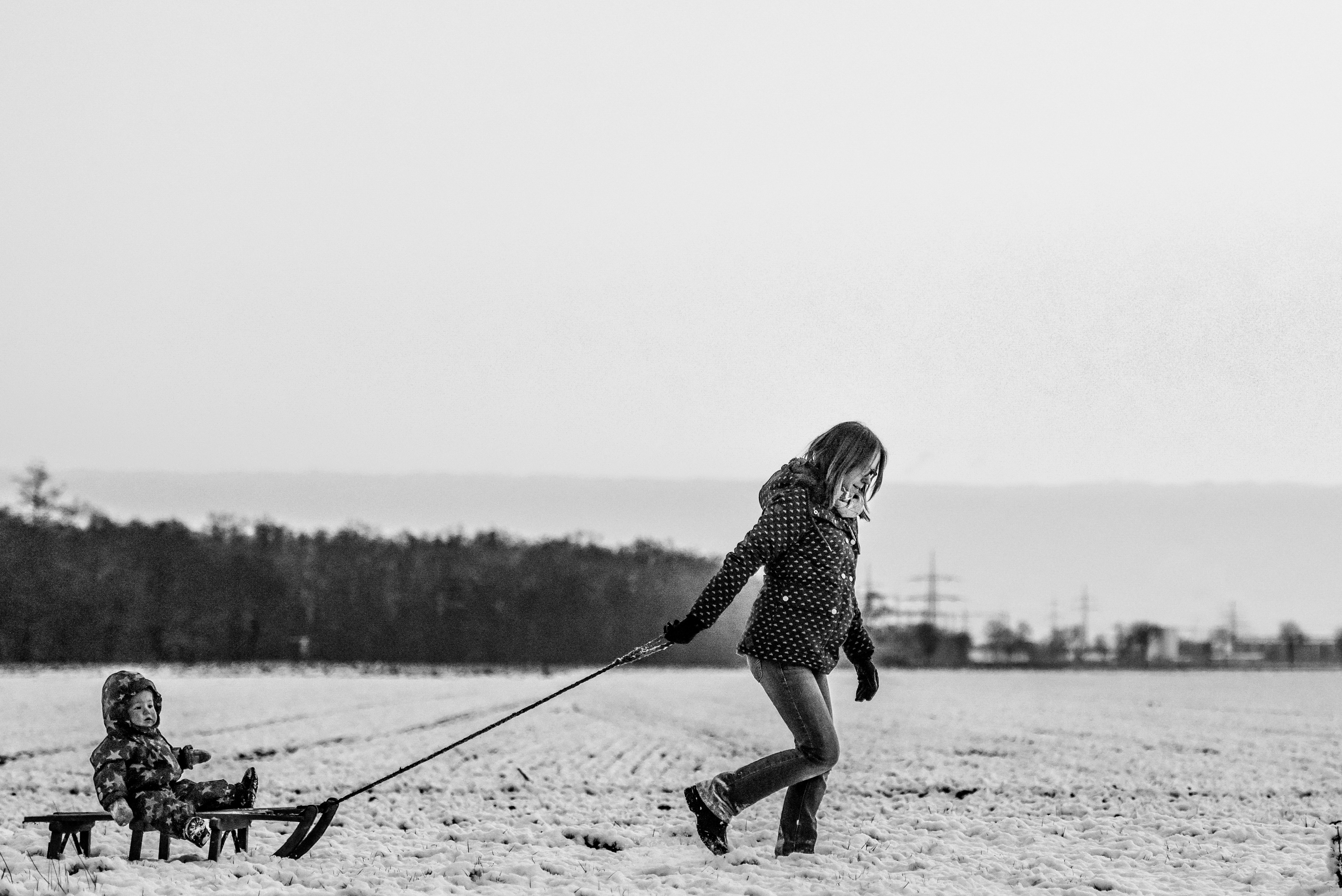 Woman Child Snow Sledge