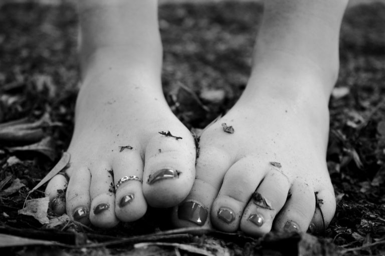 Woman Feet Black White Leaves Royalty Free Photo