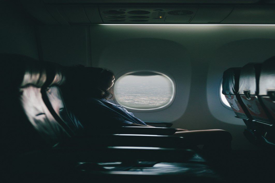 Woman Plane Window