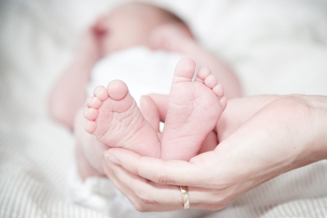 Tiny Baby Feet Woman Hand