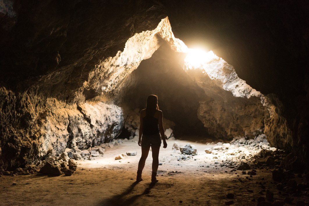 Woman Exploring Cave