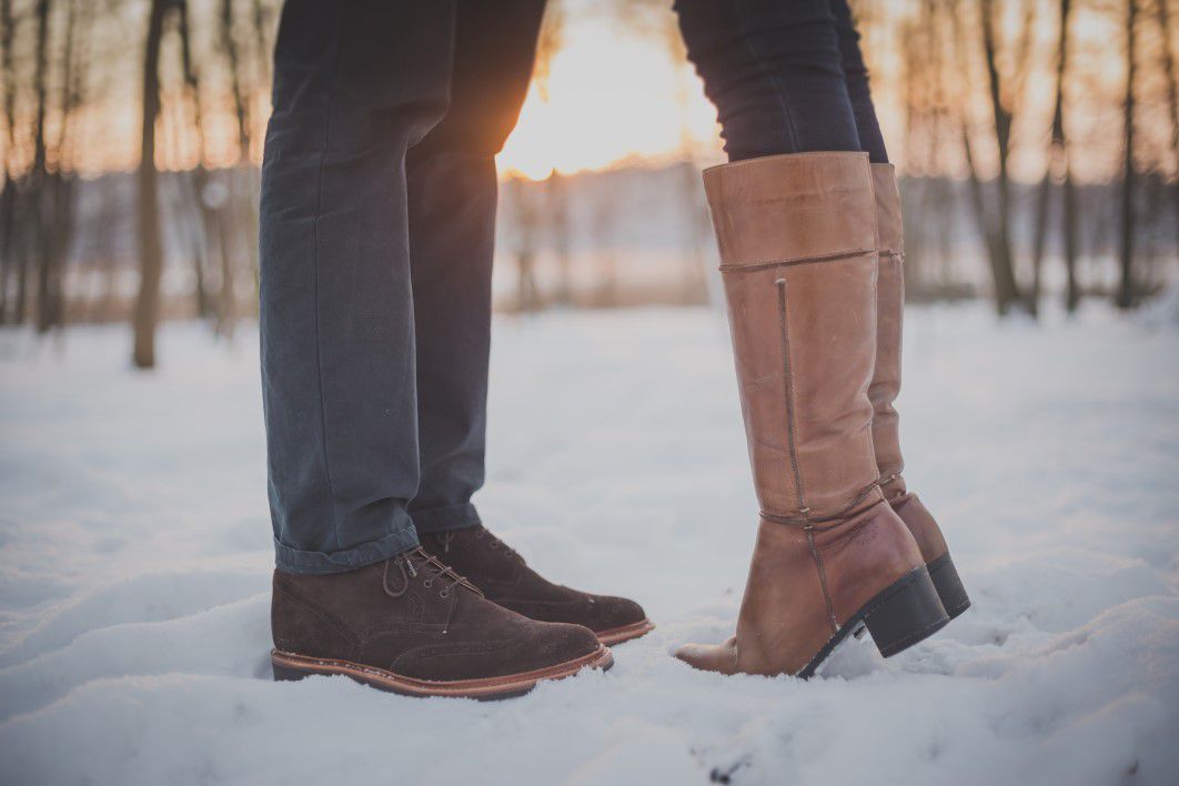Man Woman Kiss Snow Boots Sunset