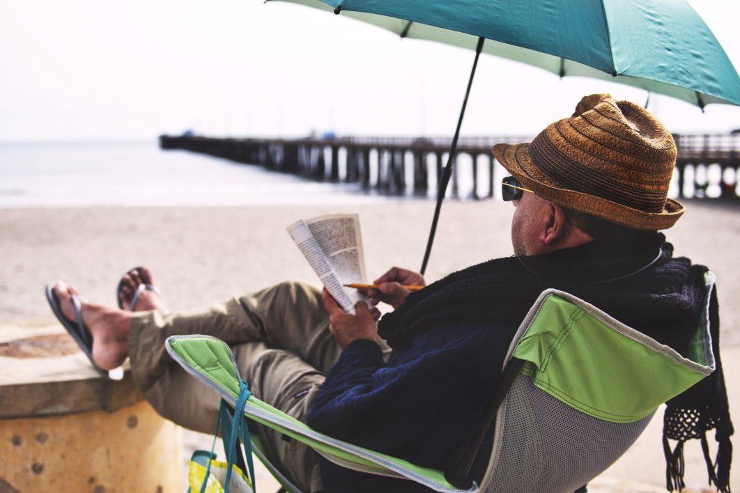 Man Chair Beach Book Sand Hat
