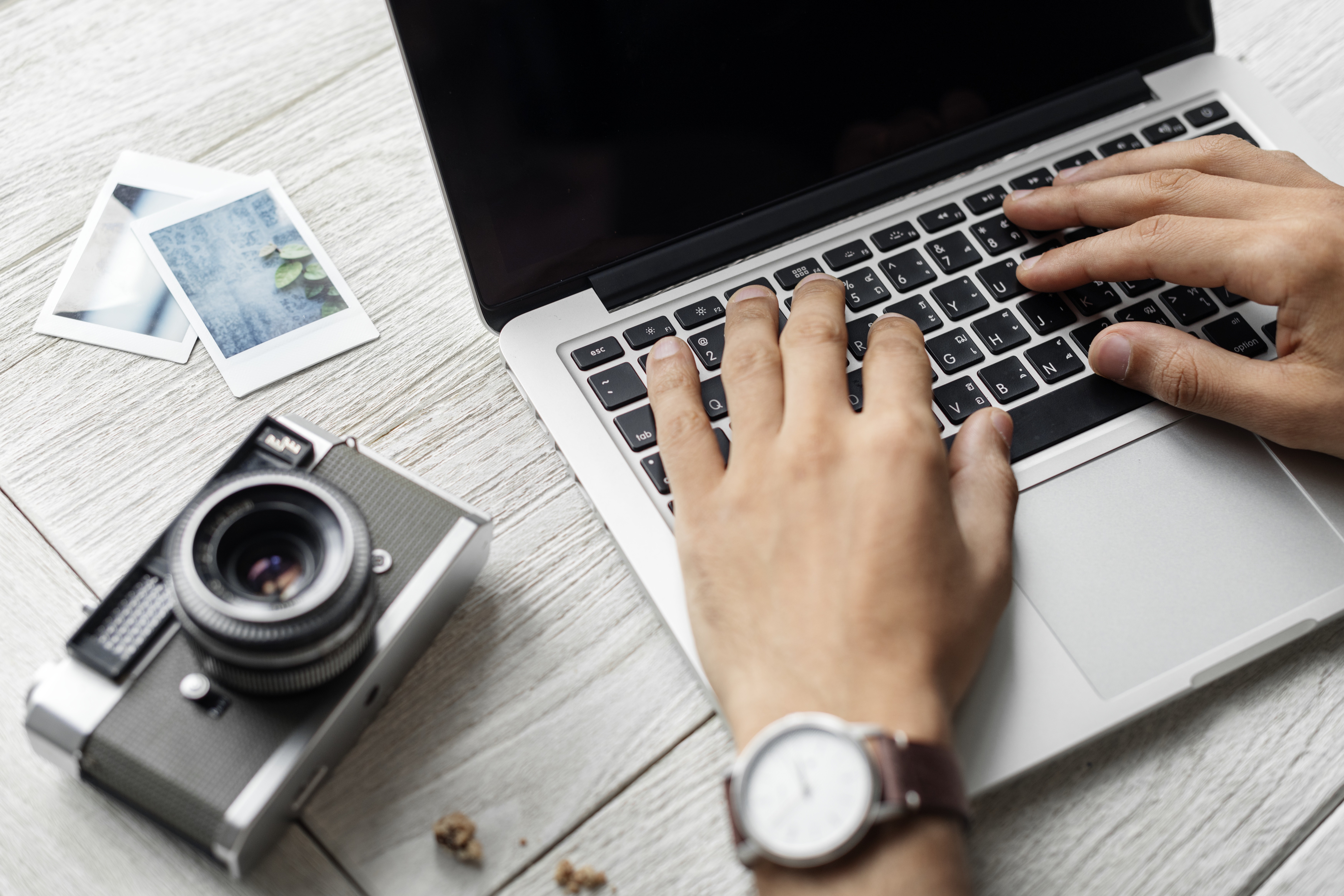 Photographer Typing Laptop Camera Desk