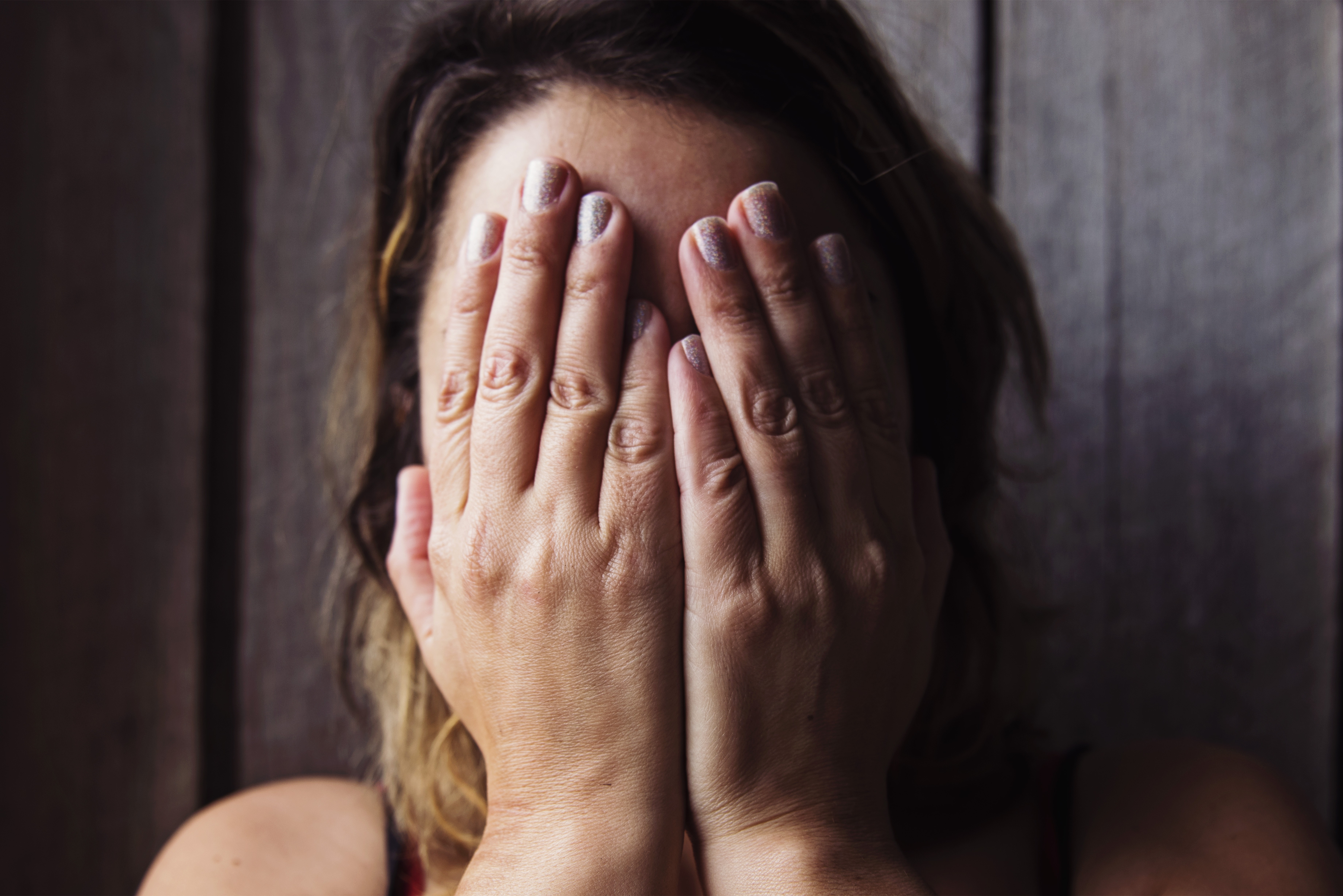 Woman Covering Face Hands