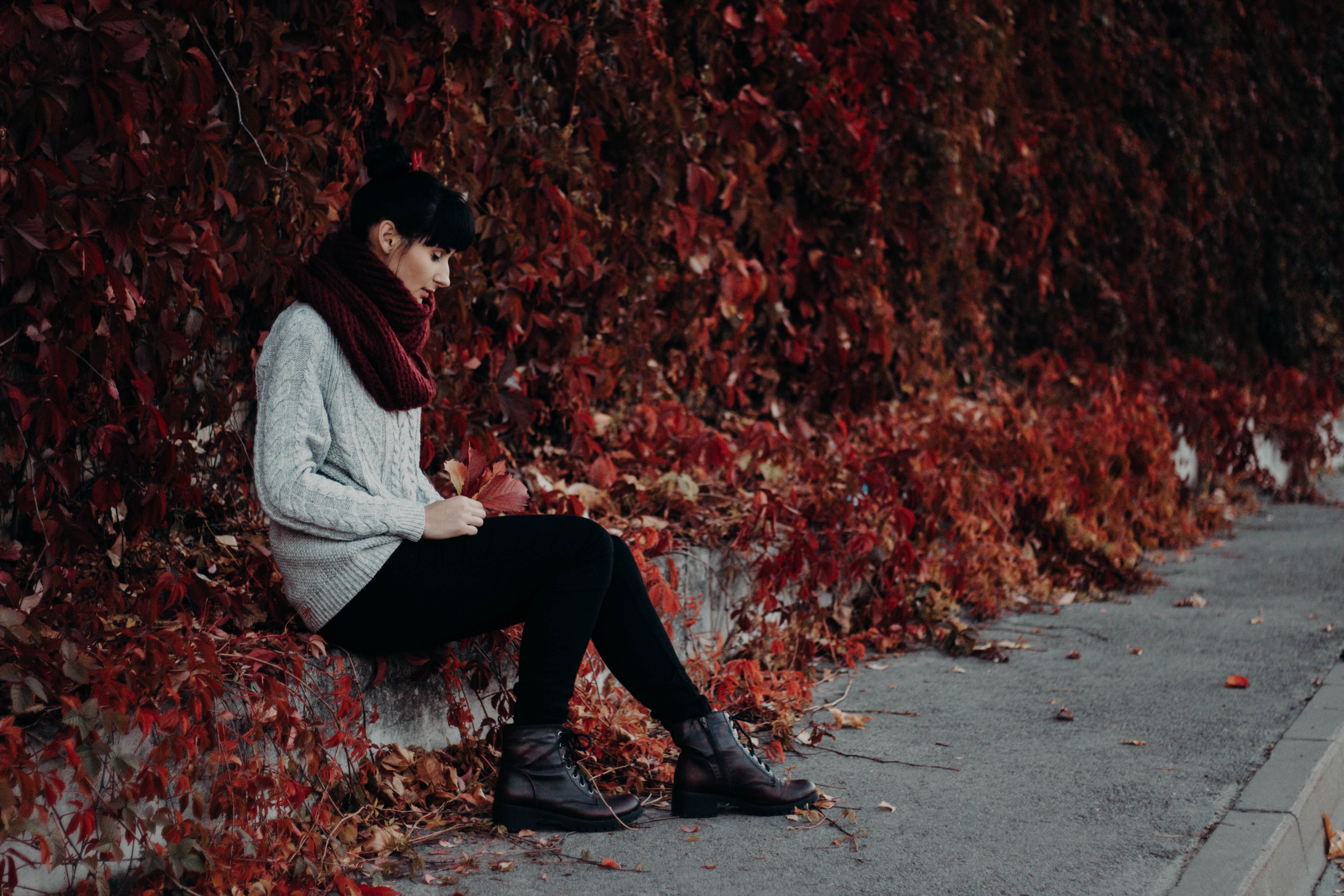 Woman Sitting Red Leaves