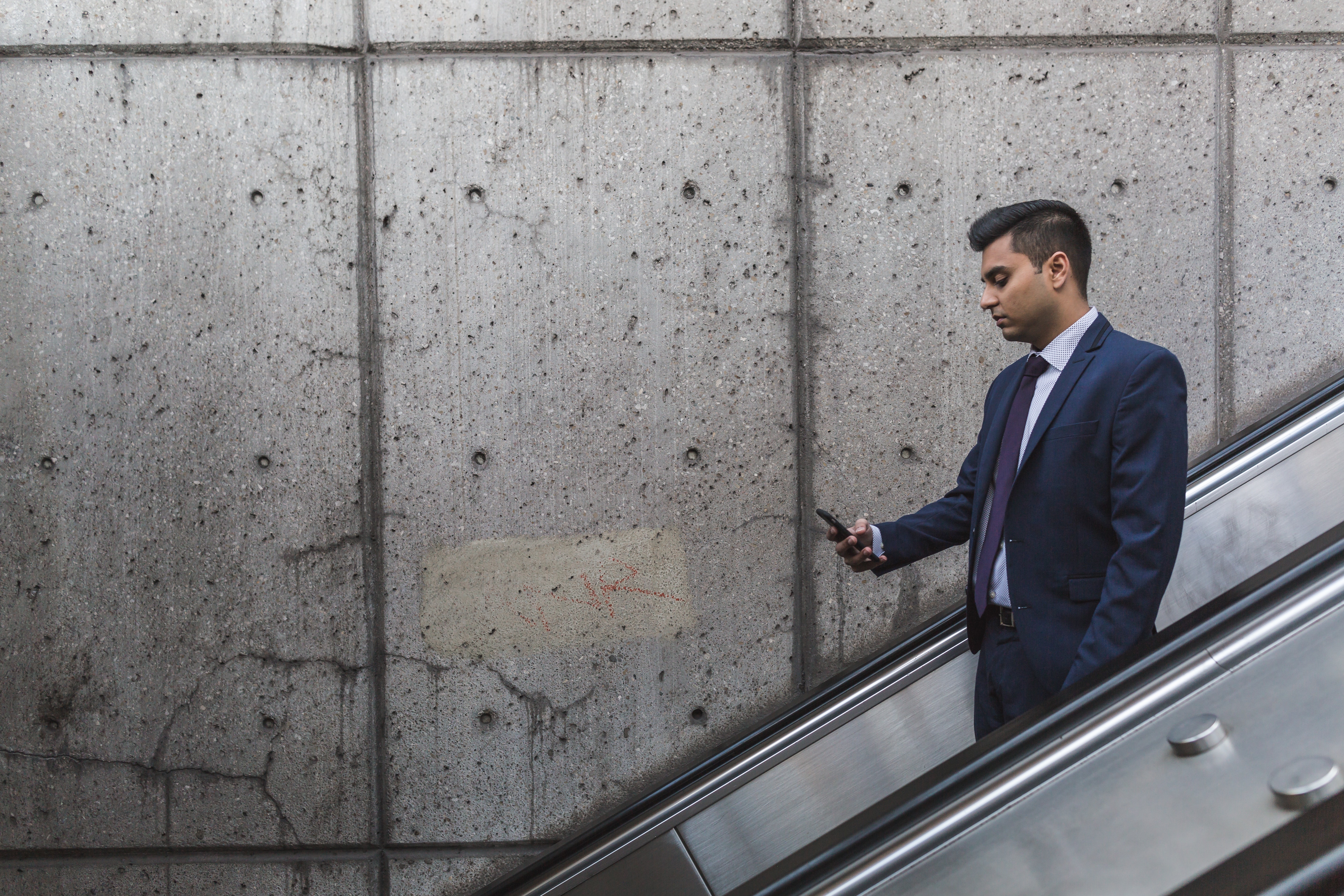 Businessman Mobile Phone Escalator