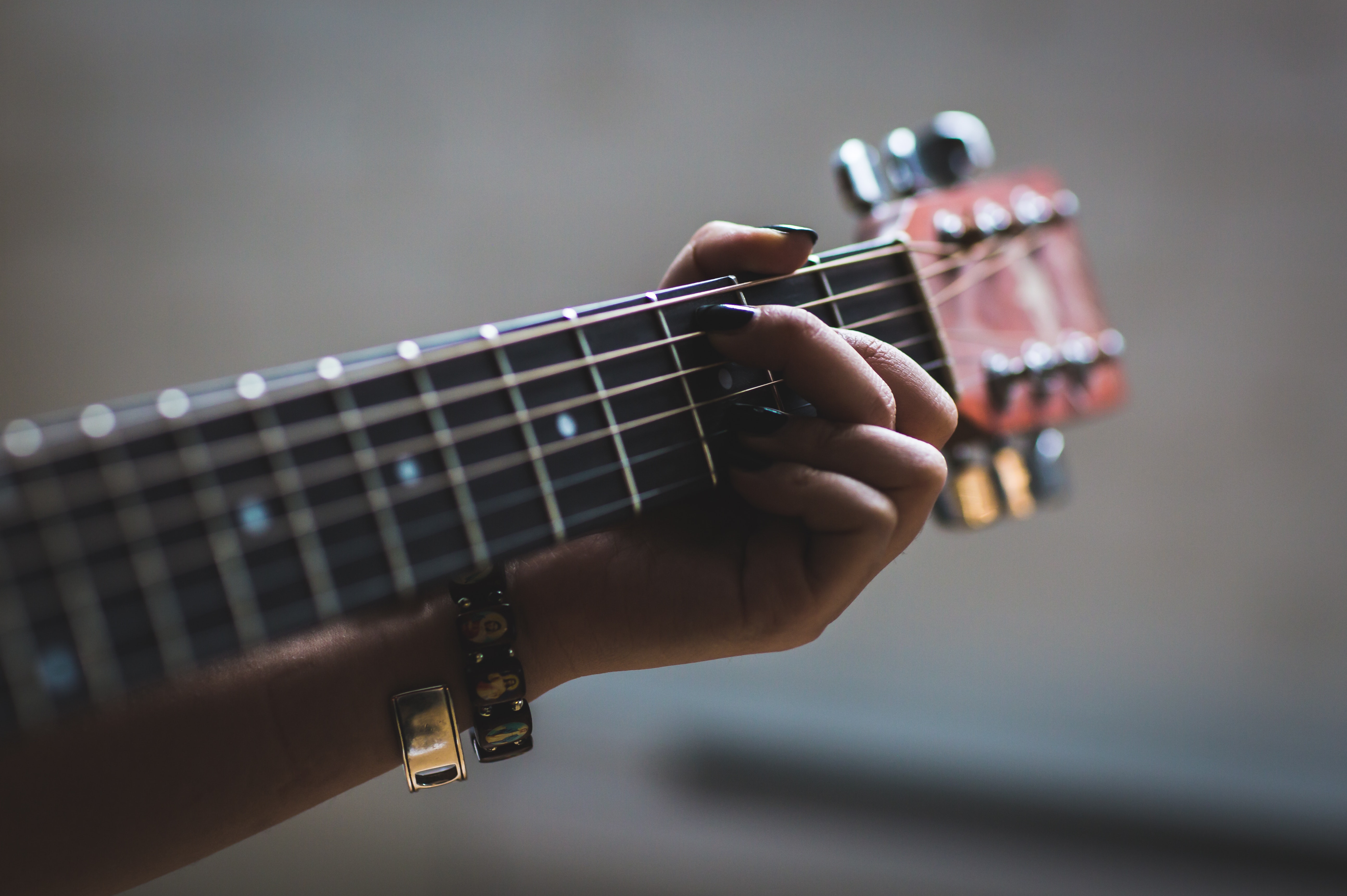 Close Up Woman Playing Guitar