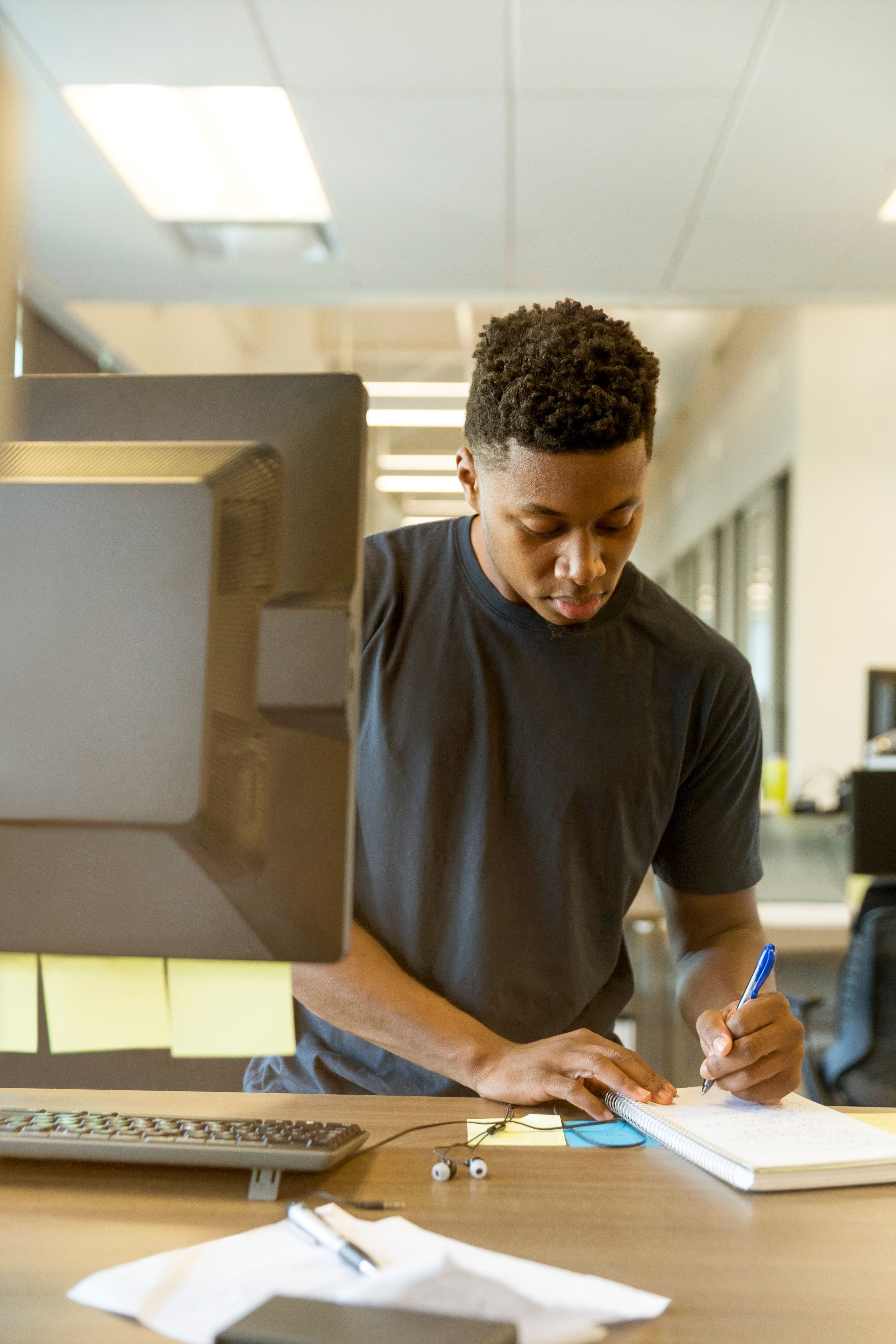 Man Taking Notes Computer