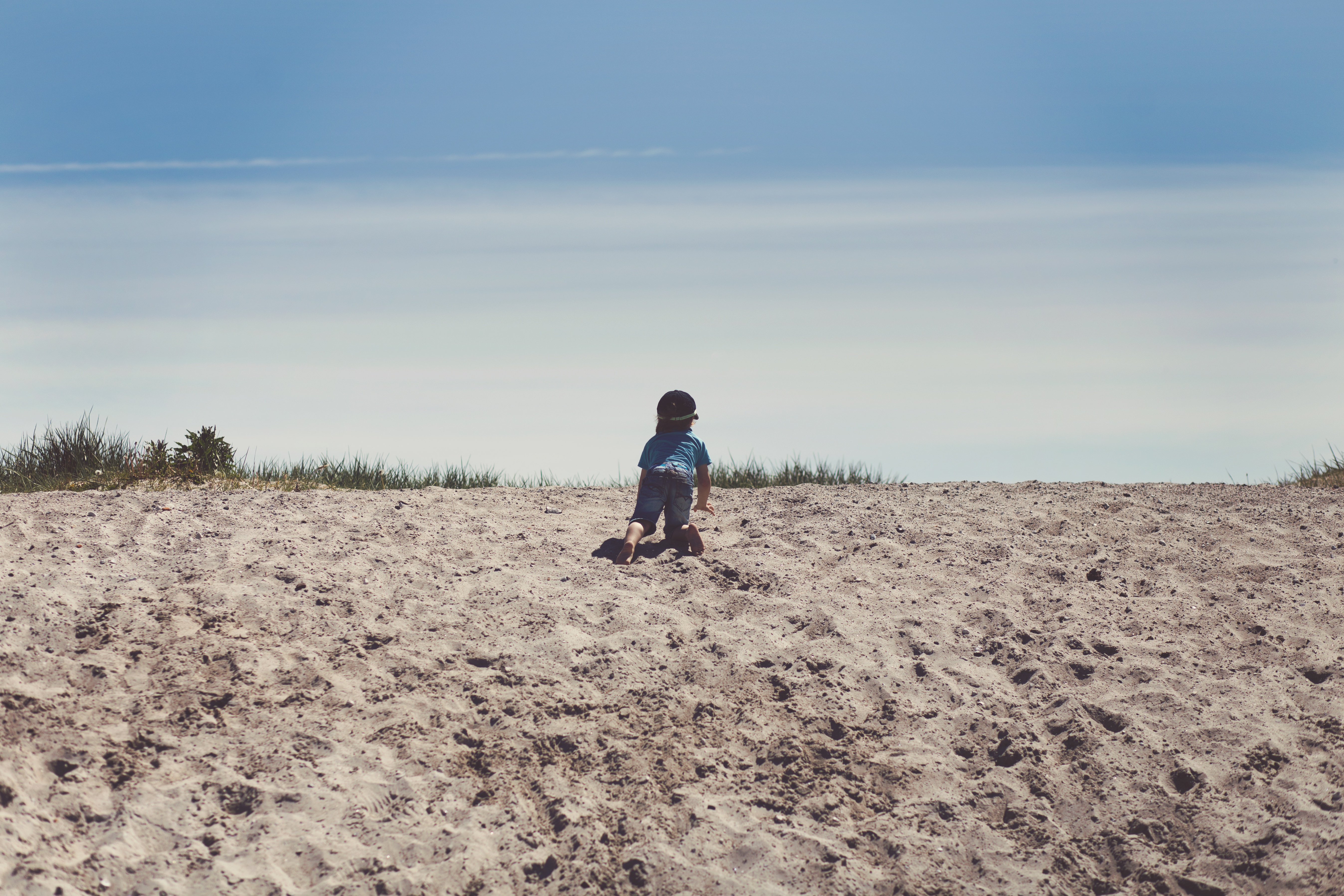 Child Crawling Sand