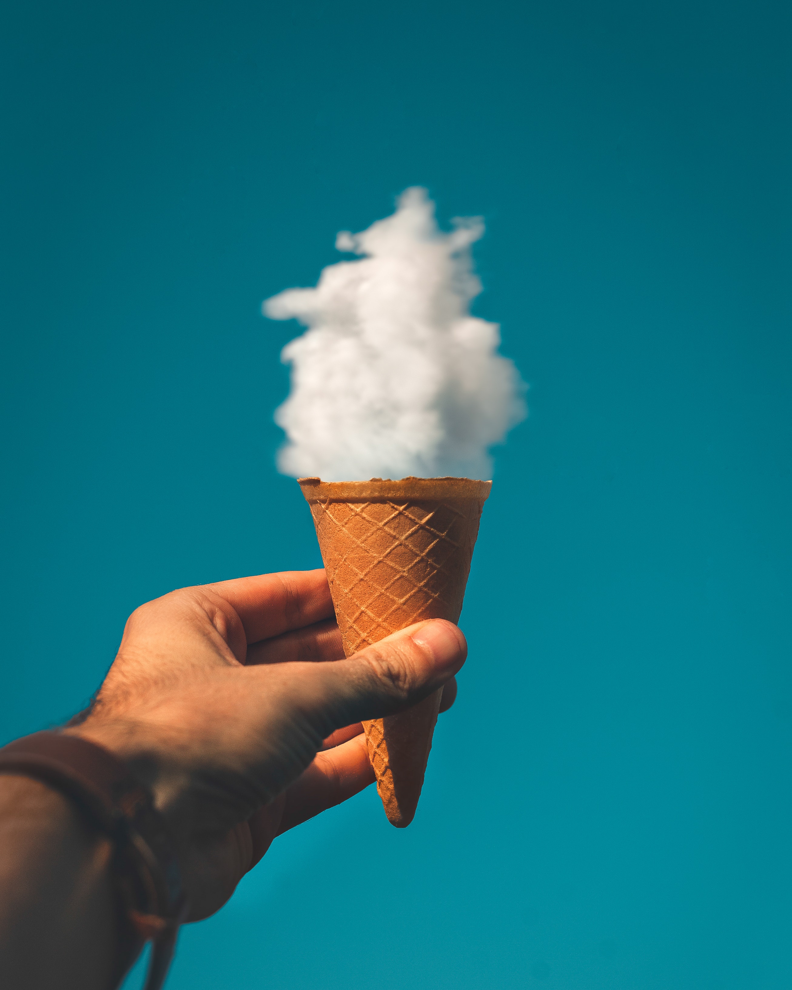 https://negativespace.co/wp-content/uploads/2018/08/negative-space-ice-cream-cone-clouds-blue-sky-man-hand-rakicevic-nenad.jpg