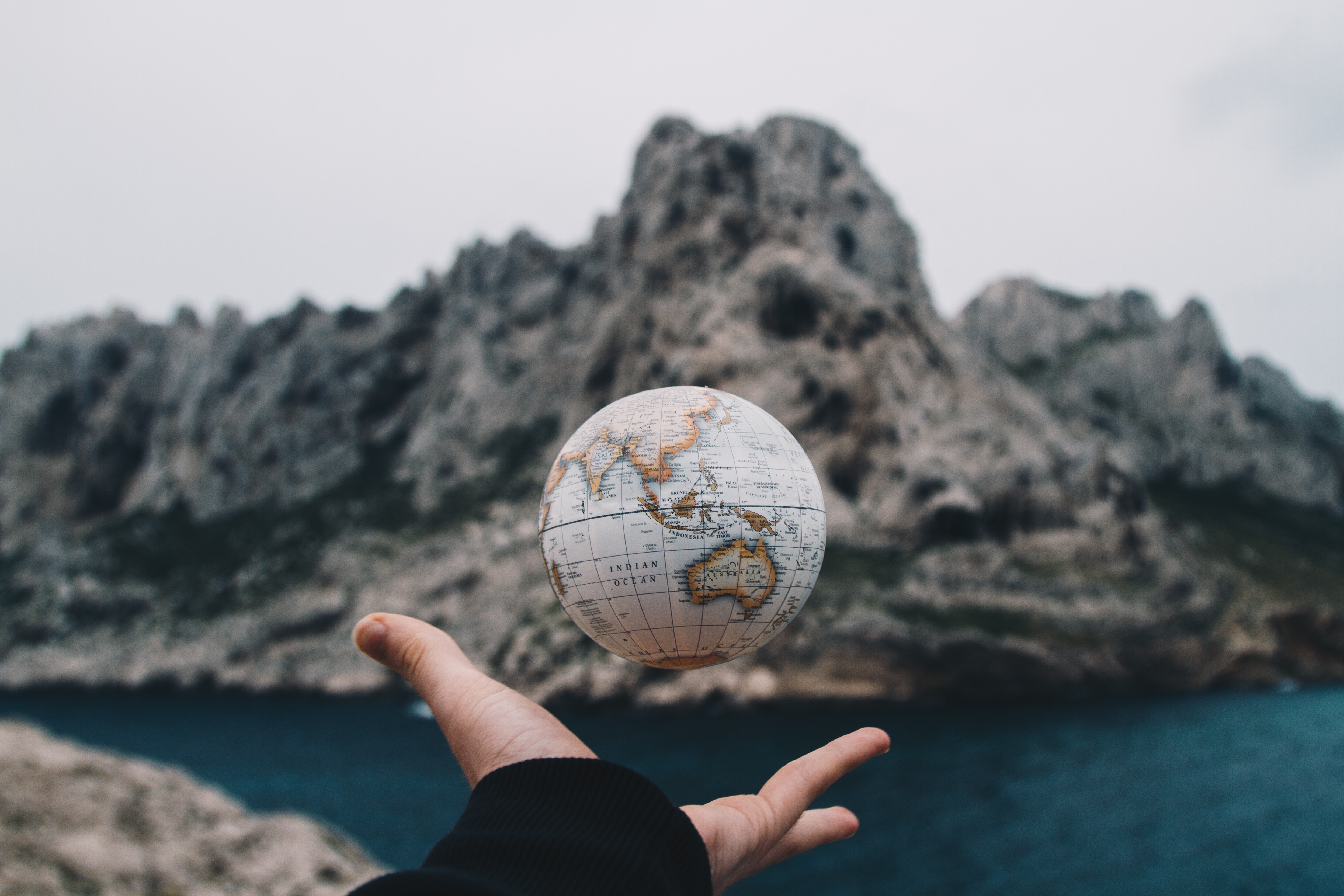 Man Throwing Globe