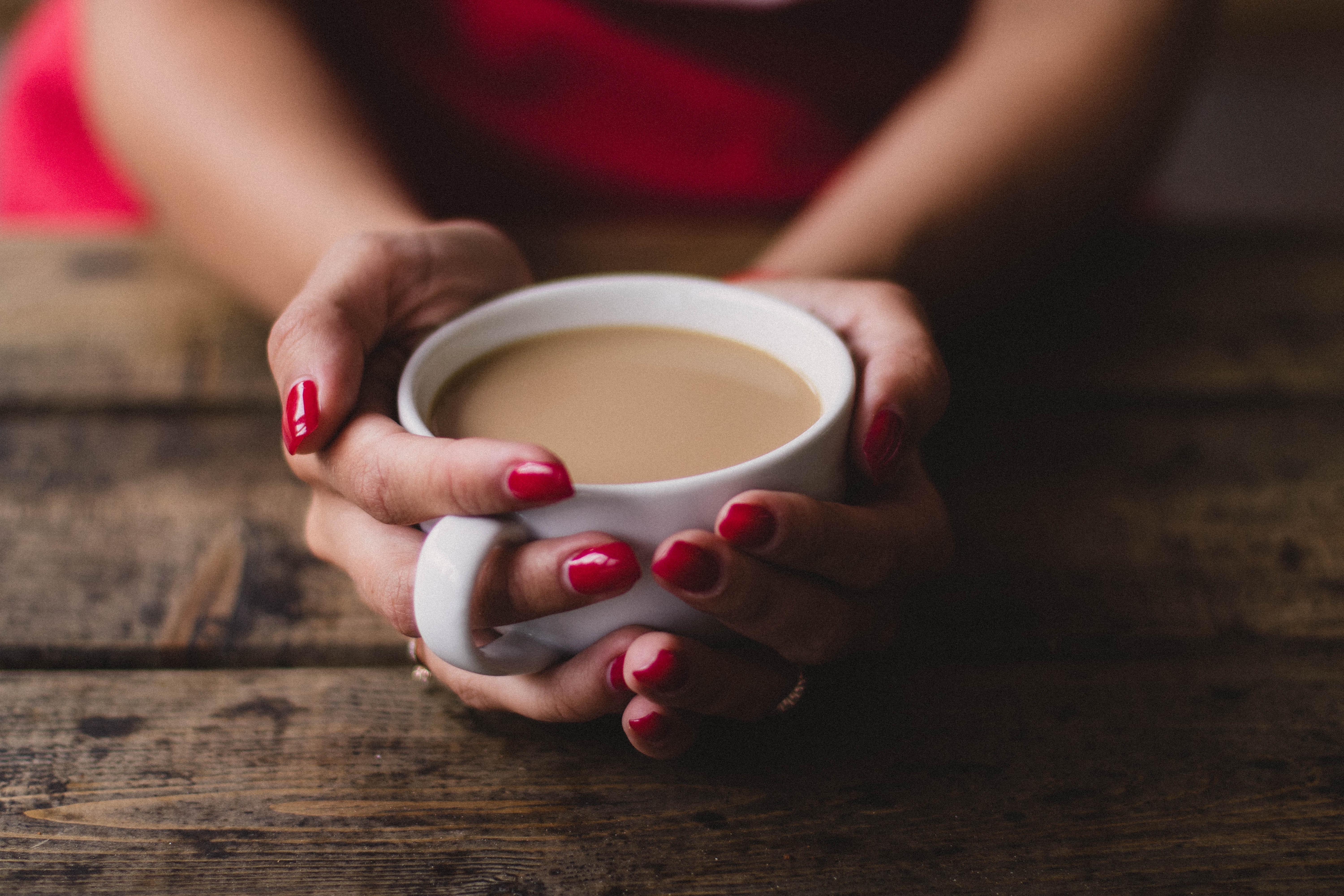 Woman Holding Coffee