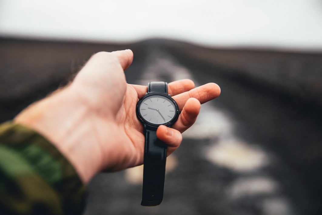 Holding Watch Outdoors