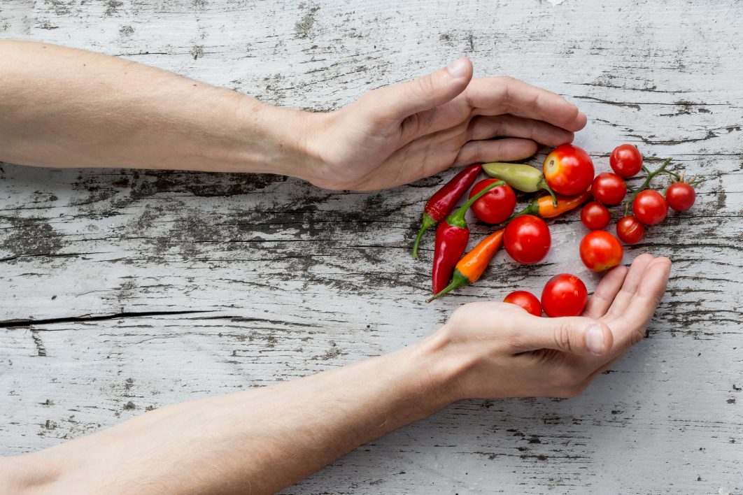 Hands Holding Vegetables