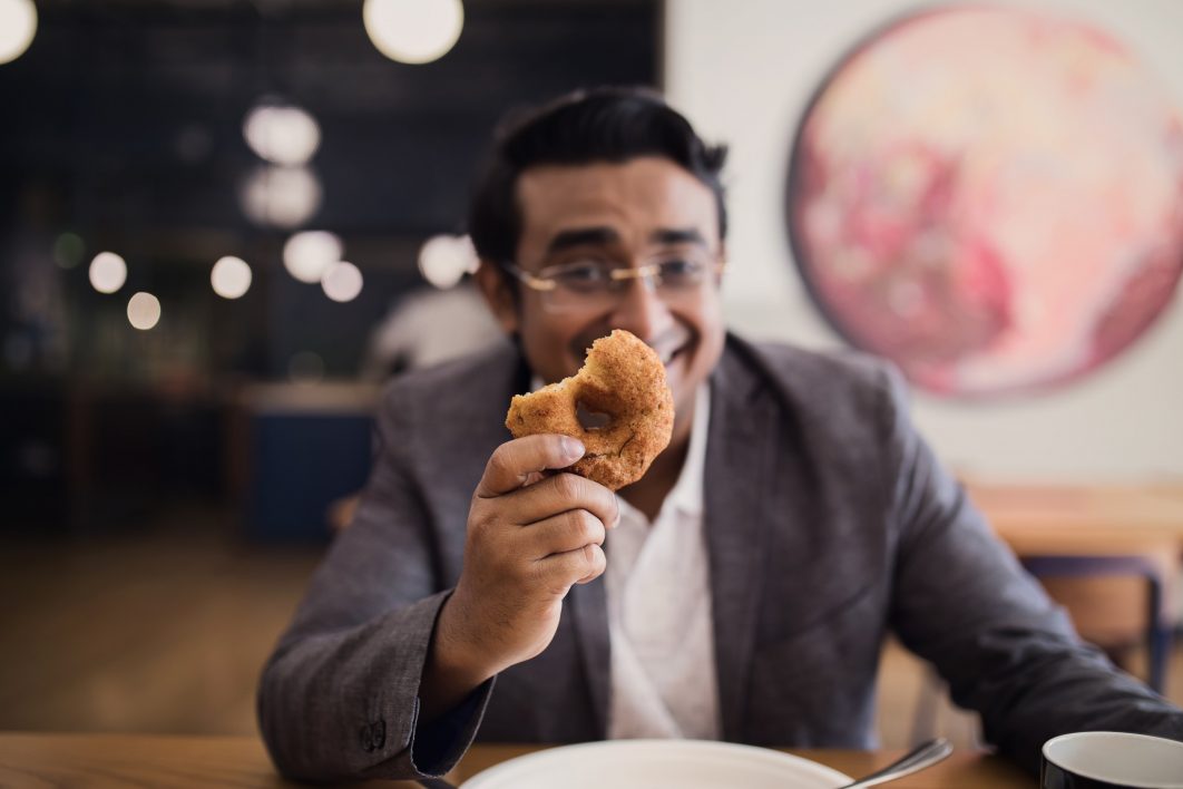 Man Holding Donut