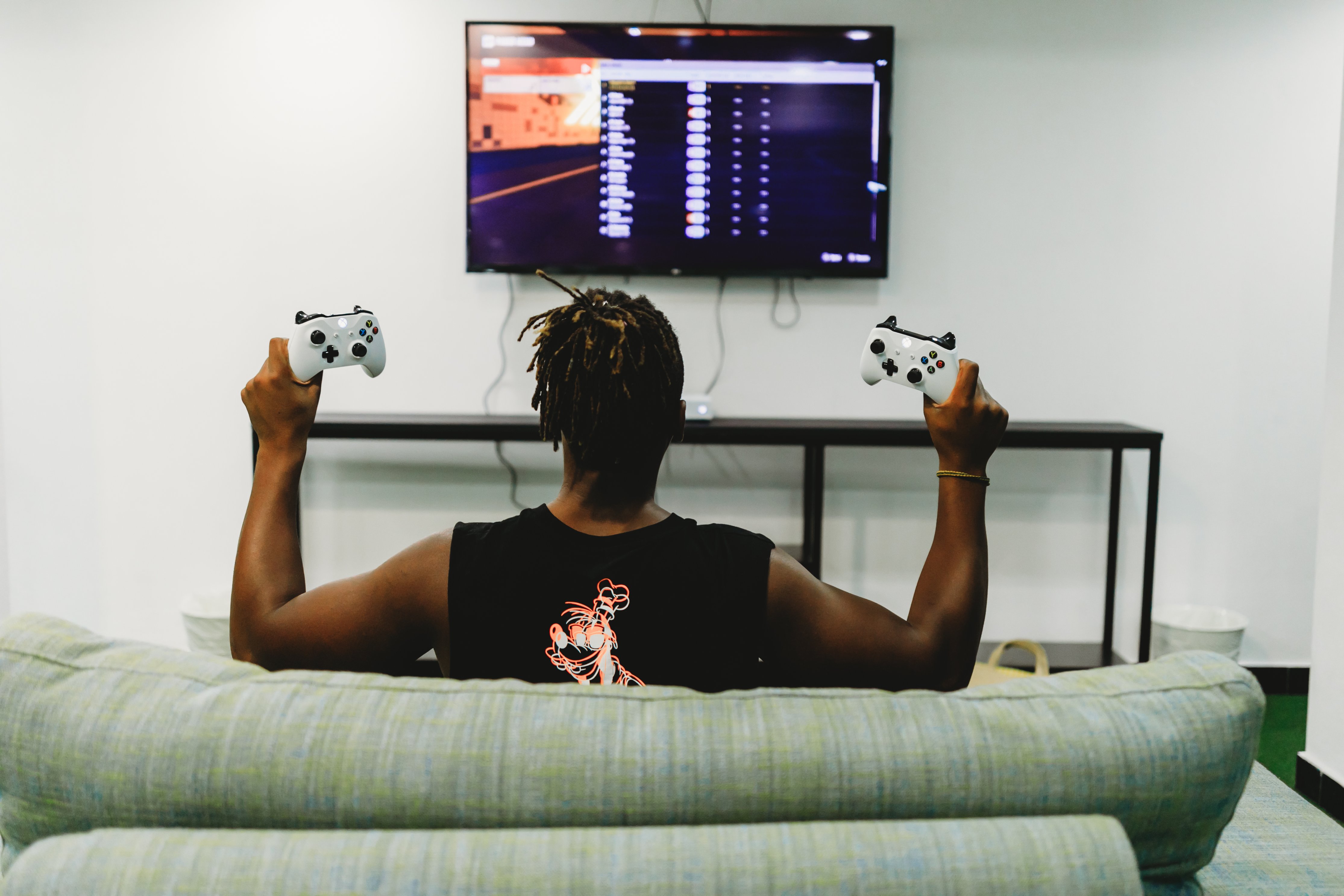 Man gamer teaching his girlfriend playing space shooter video game Stock  Photo by ©DragosCondreaW 465086788