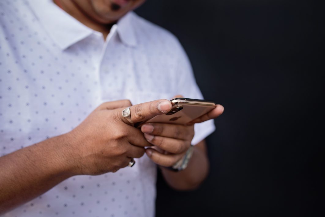 negative-space-hands-holding-a-phone-1062x708.jpg