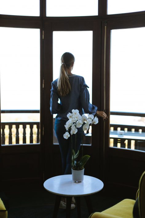 Orchid and Woman by Window