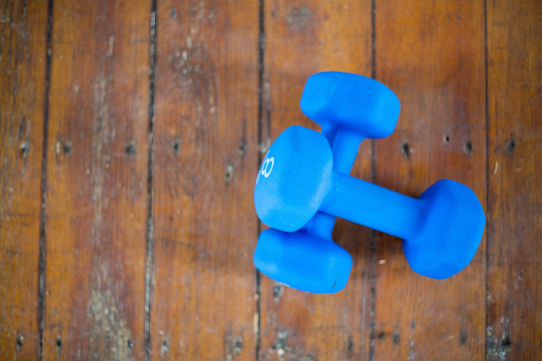 Exercise Hand Weights On A Wooden Floor Stock Photo, Picture and