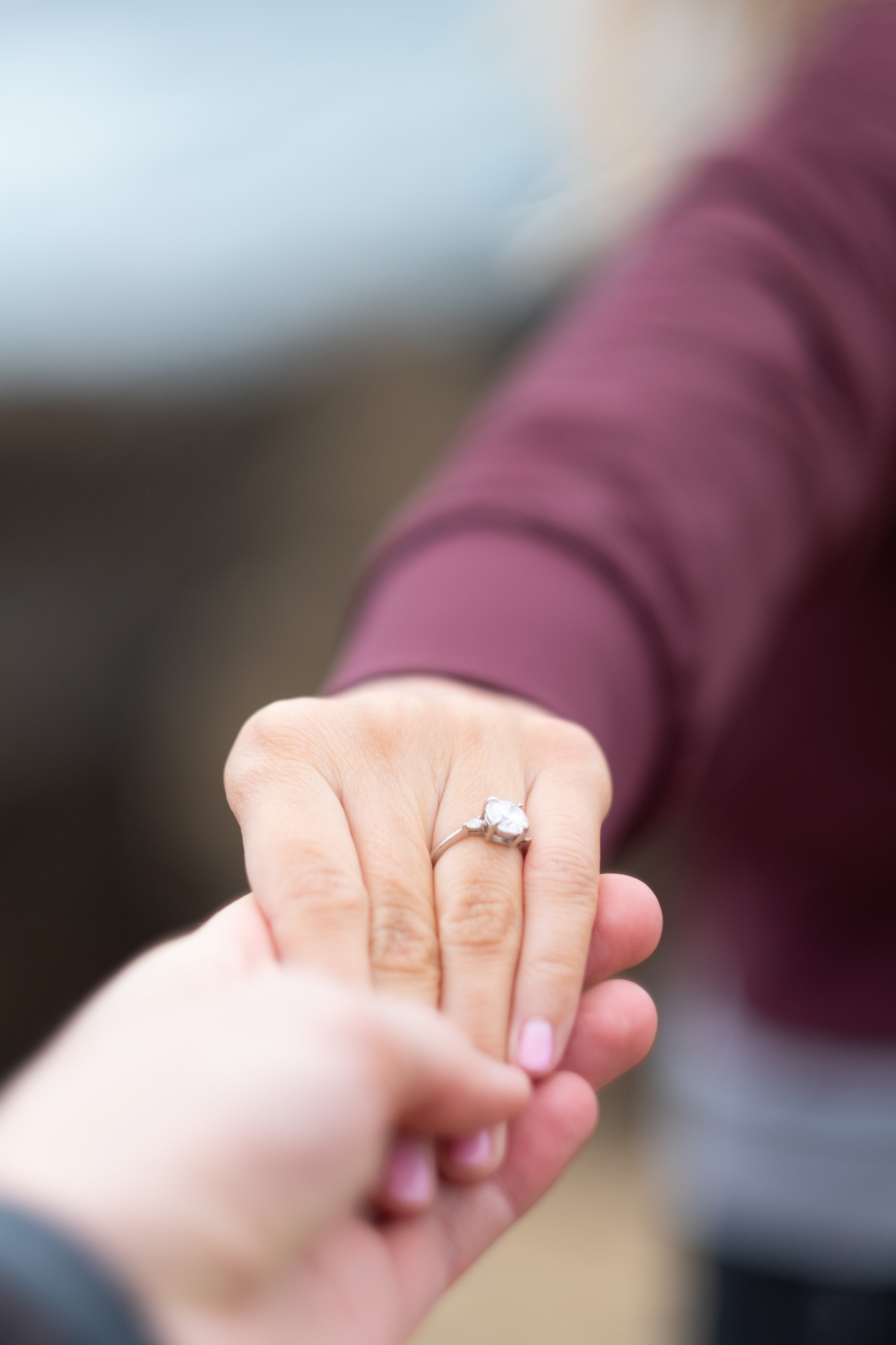 Two hands with one wearing an engagement ring - Stock Image - F033/9094 -  Science Photo Library