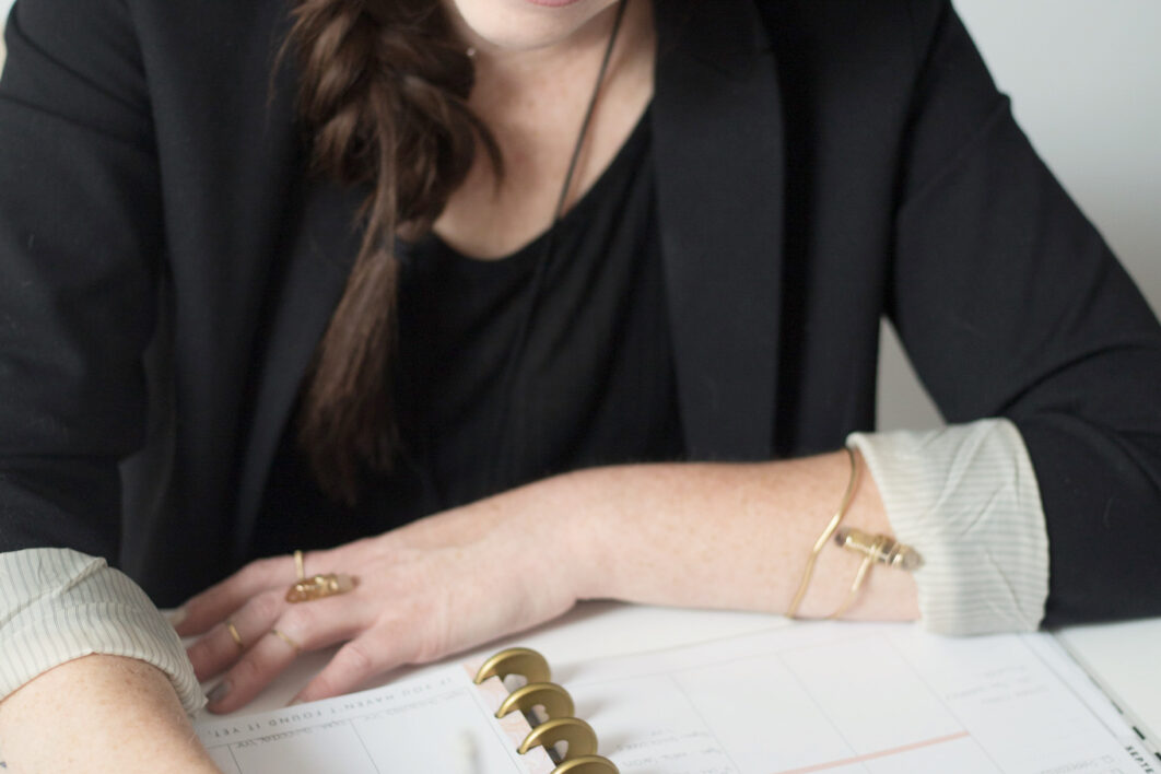 negative-space-smiling-desk-writing-woman-1062x708.jpg