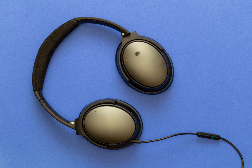 negative-space-headphones-on-blue-backgr