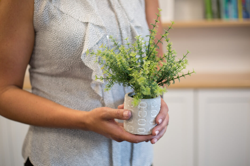 Holding Plant Woman