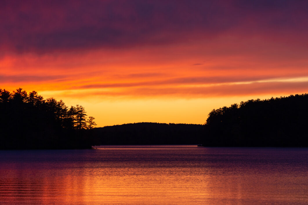 negative-space-vibrant-lake-sunset-forest-mountain-1062x708.jpg