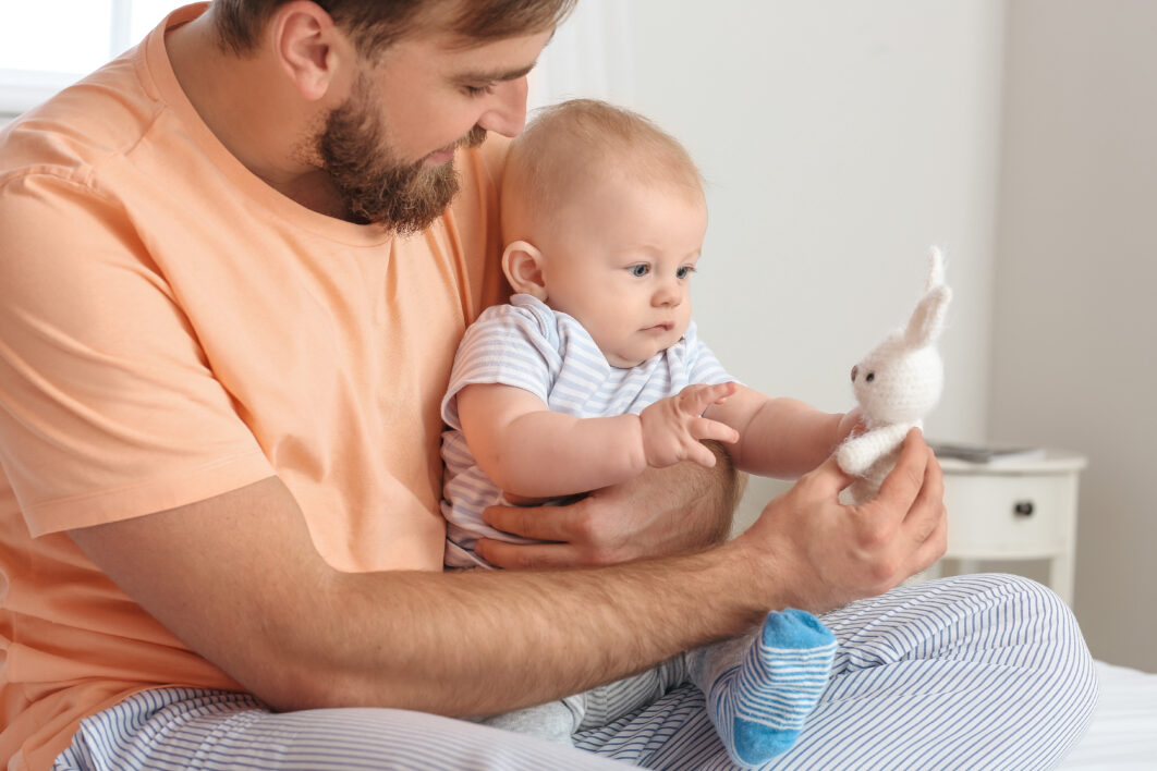 Father with Baby and Bunny Toy